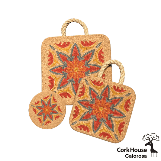 All three pieces in the azuljos Calorosa collection. The large 8in hot pad, small 6in hot pad both with a rope handle and coaster. Each item has a red and orange floral tile print outlined in a green/blue.