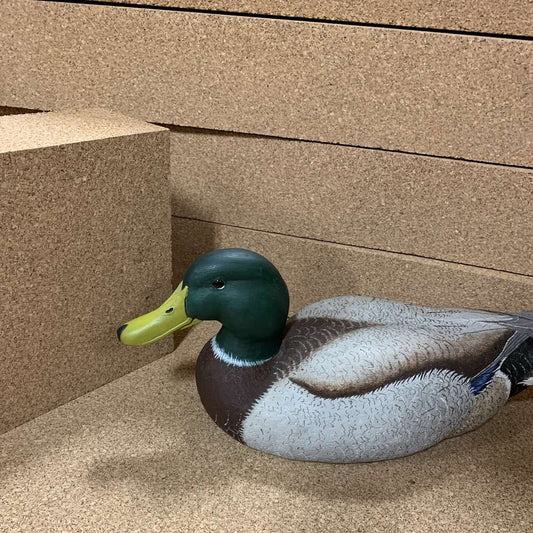 4-inch thick high-density cork carving block with a carved duck decoy.