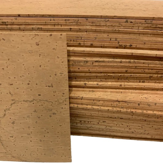 A stack of high quality, all natural solid cork sheets for musical instruments.