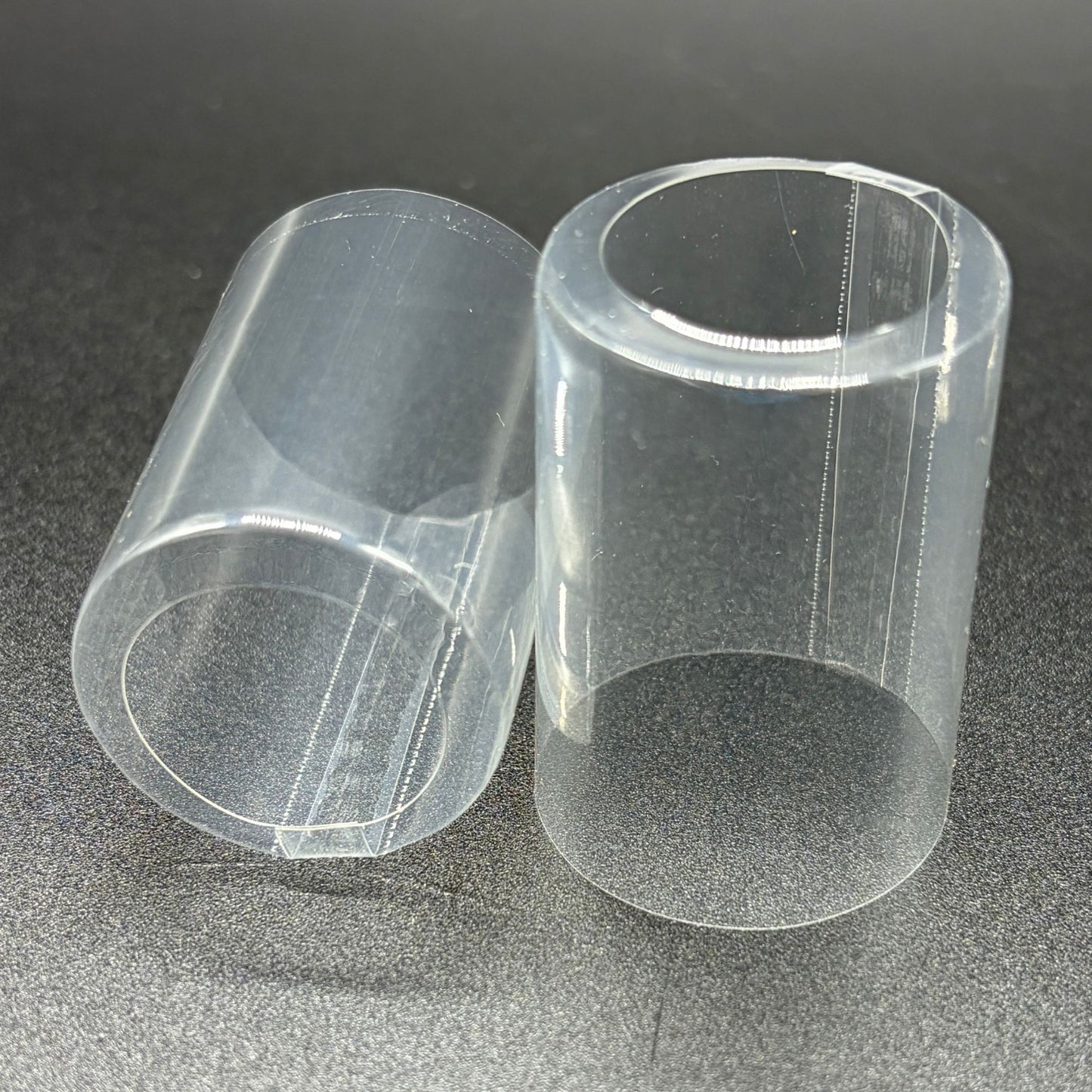 Shrink caps, clear with open top and vertical double perforation
