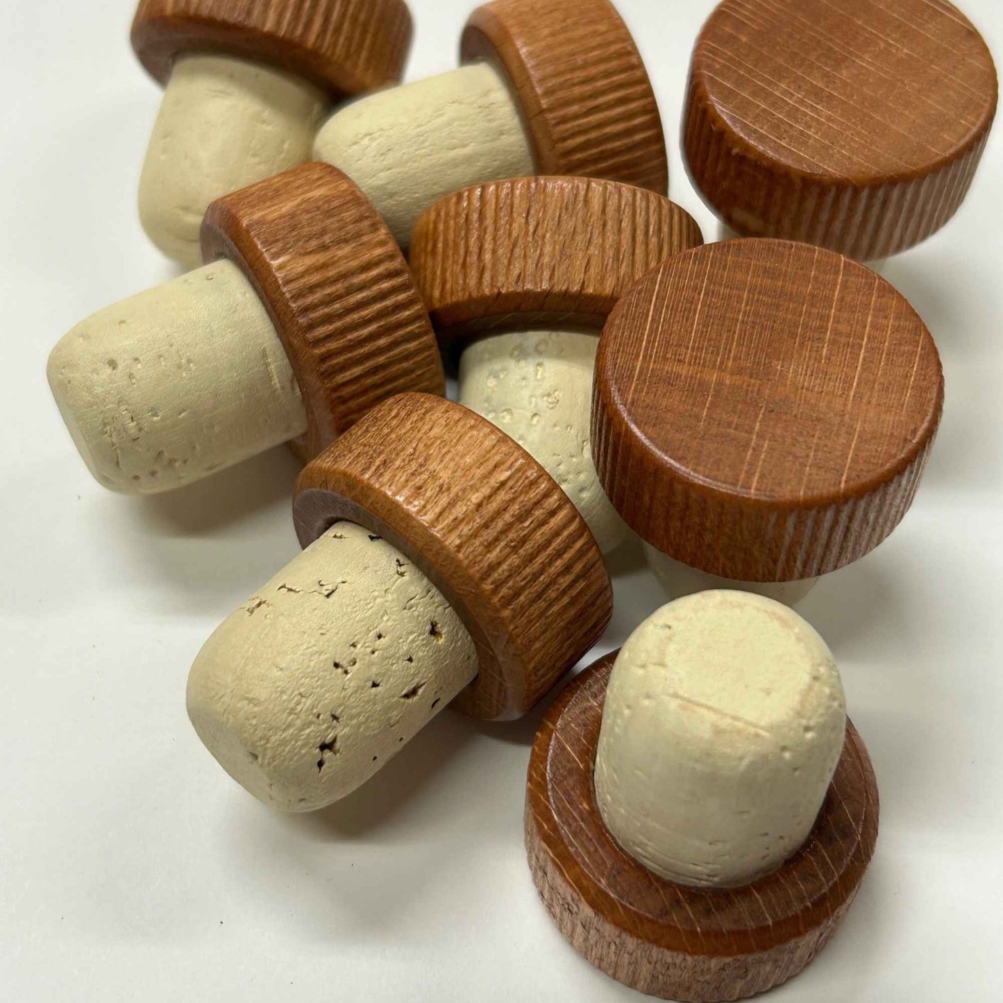 Light brown wood cap cork stoppers with a natural cork stem
