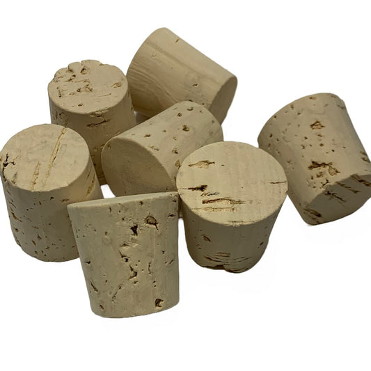 Handful of natural tapered corks showing the top, bottom and sides of the RL14 cork stopper
