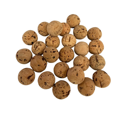 Solid natural cork balls in a pile to show variations in composition, shade