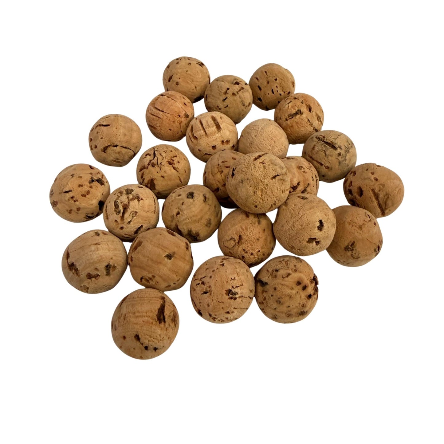 Solid natural cork balls in 12.7mm diameter, in a pile