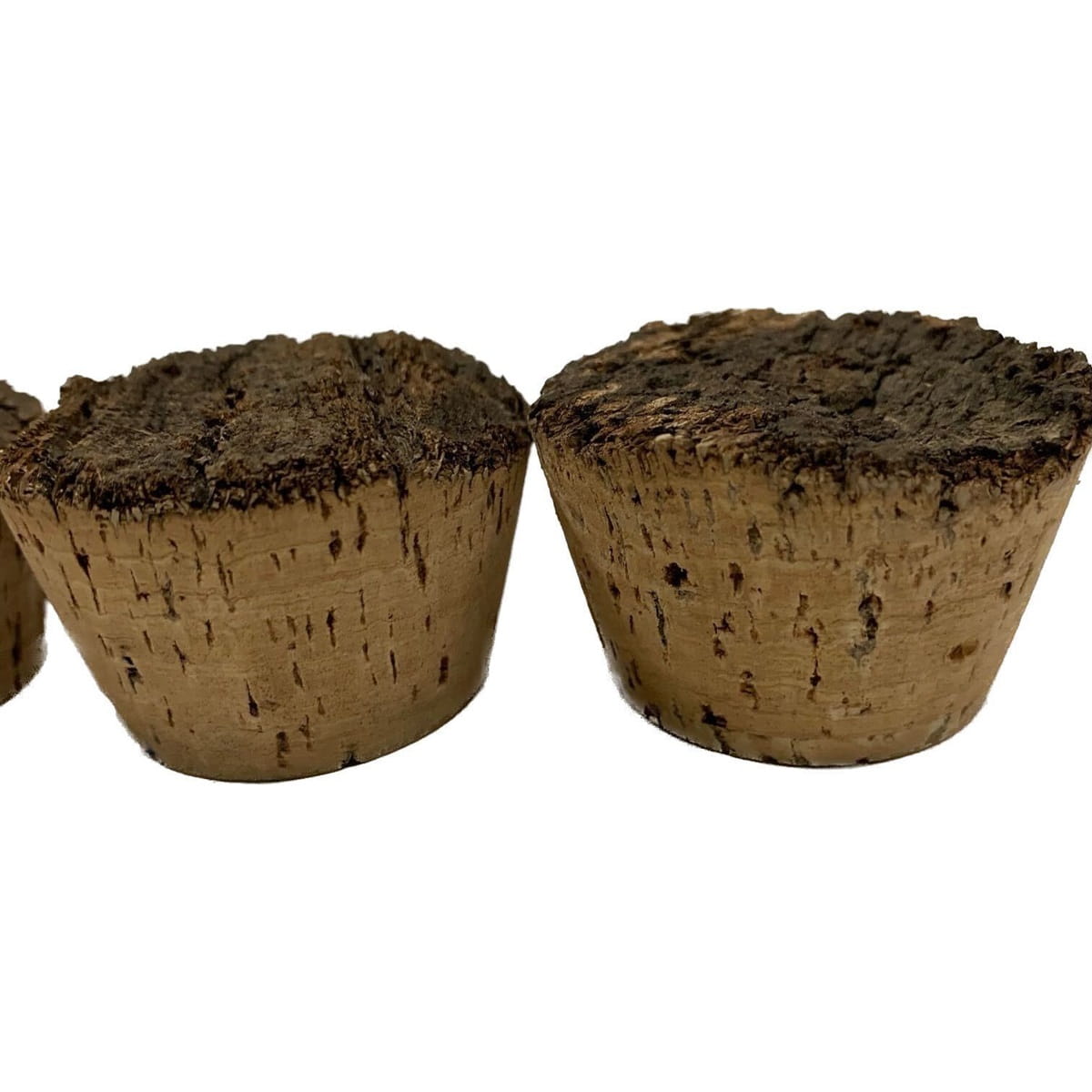 Two natural cork stoppers, showing the dark, rough, natural texture of the top and smooth, refined surface of the bottom.