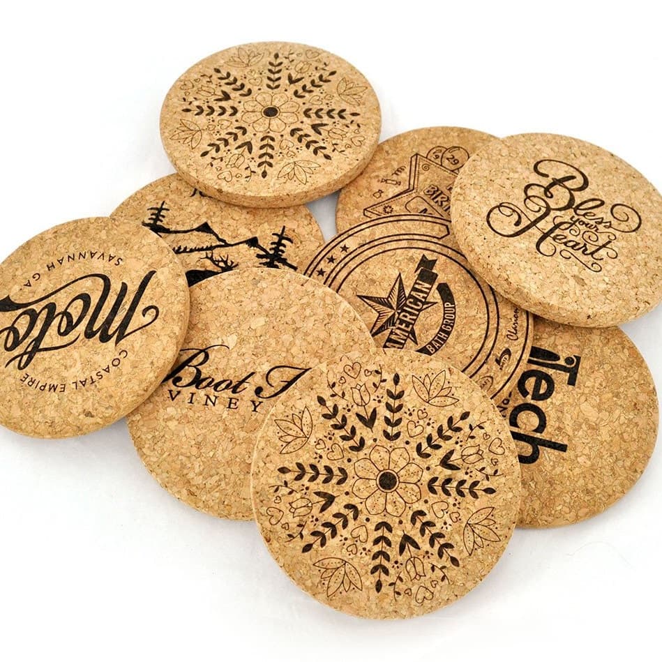 Set of round cork coasters with various designs and text to show custom printing