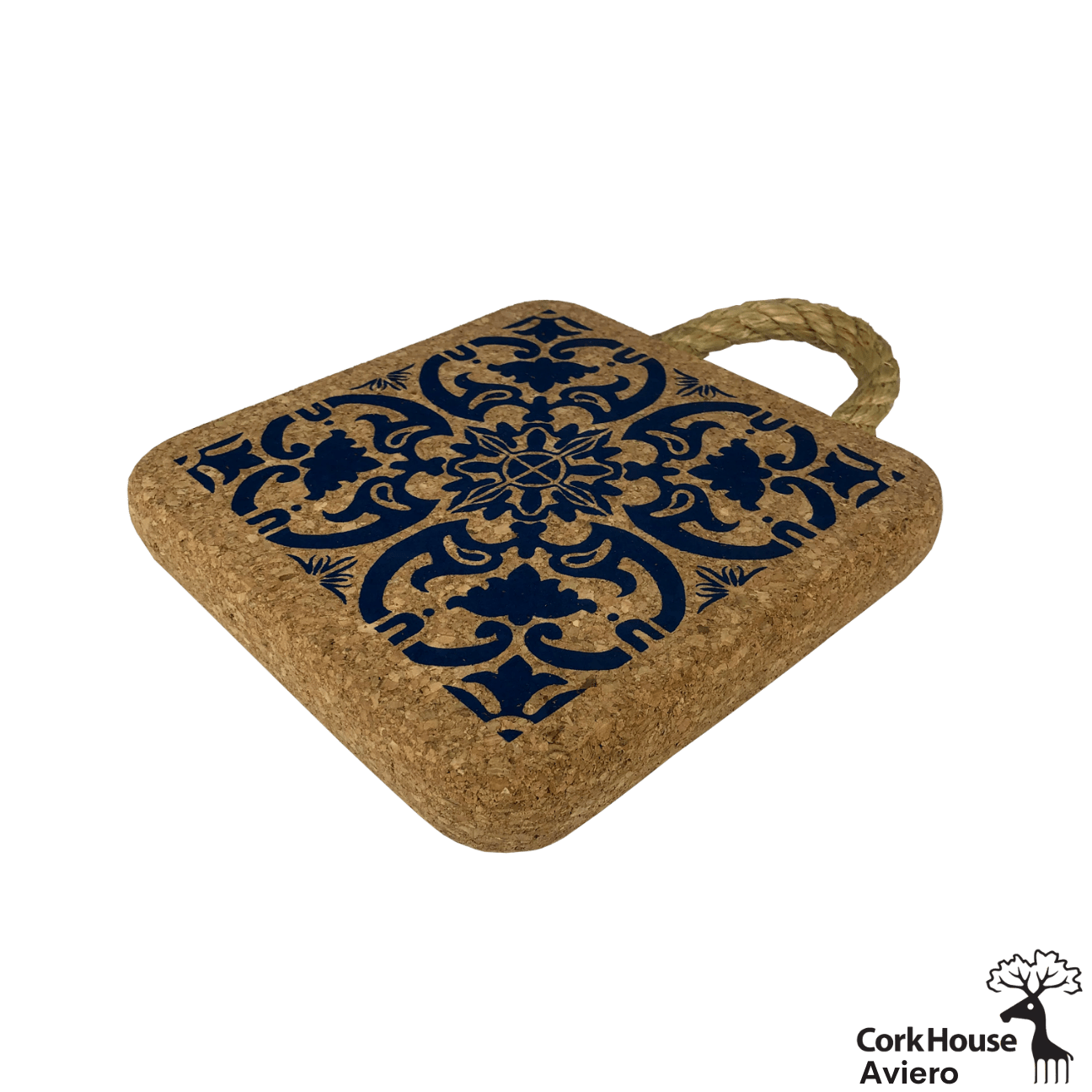 A side view of the cork hot pad features a rope handle for hanging and a cobalt blue traditional tile pattern. 