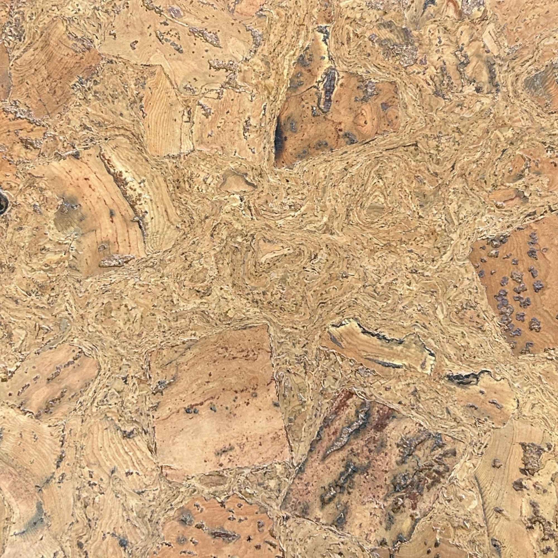 A close-up of a cork floor tile in pattern Mars, showing a natural cork texture with a mottled pattern of tan, brown, and beige tones.