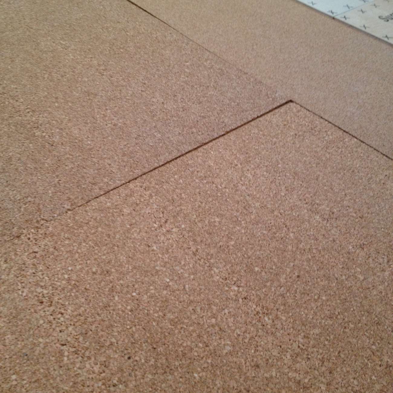 QuietCork underlayment sheets being installed