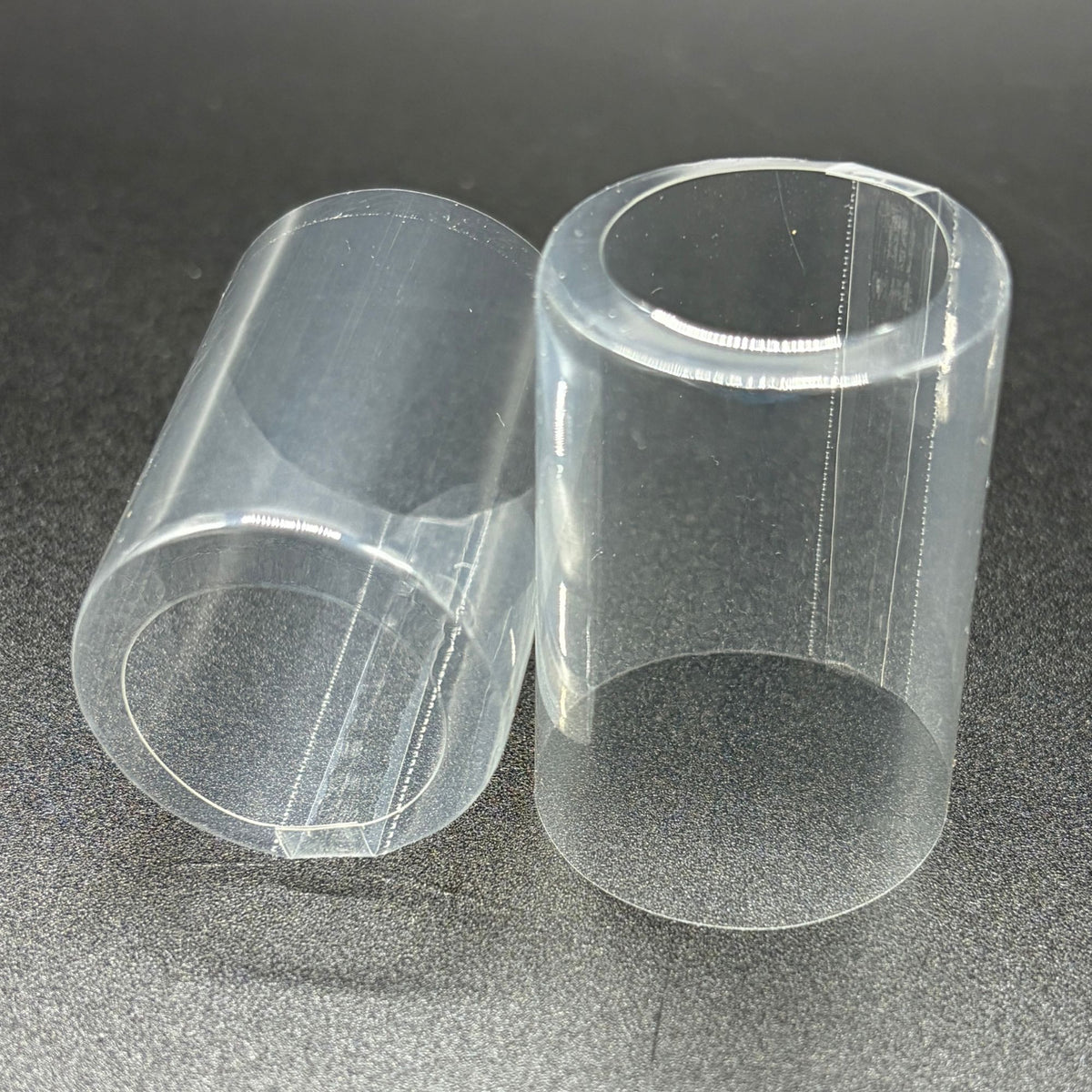 Shrink caps, clear with open top and vertical double perforation