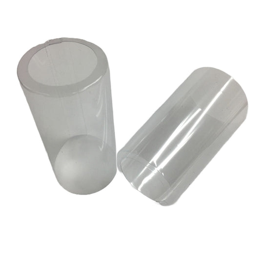 Two open cap PVC shrink caps with vertical perforation on a white background.