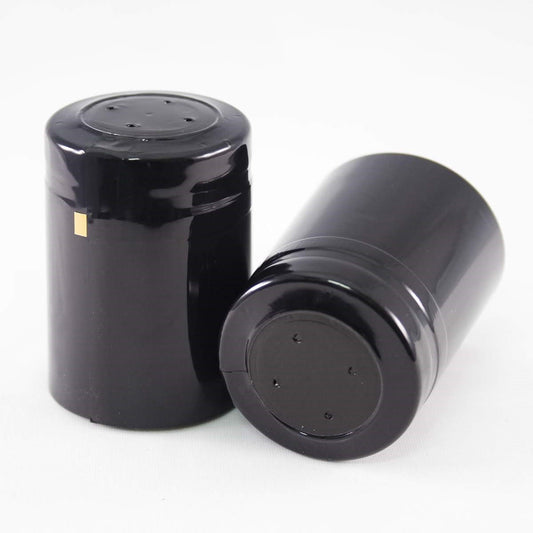 Two glossy black shrink cap with top disk and gold tear tape