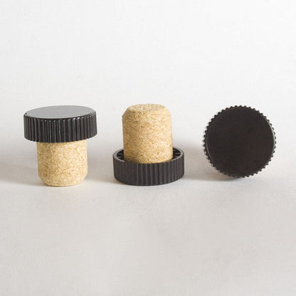 FusionCork stoppers with black ribbed plastic caps for liquor bottles