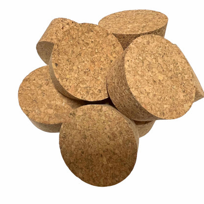 Various angled views of short-length tapered cork stoppers showing texture, size SL28