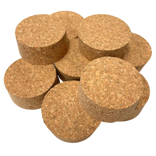 A stack of agglomerate short length tapered cork stoppers, size SL32