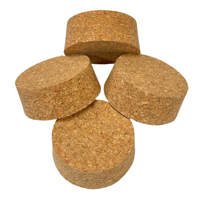 Four agglomerate short length tapered cork stoppers arranged to show various angles, size SL36