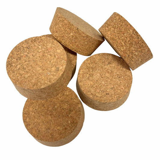 Various angled views of short-length tapered cork stoppers showing texture, size SL38