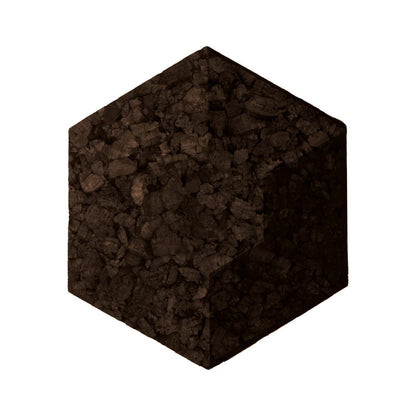 Hexagonal cork tile with a textured brown surface on a white background